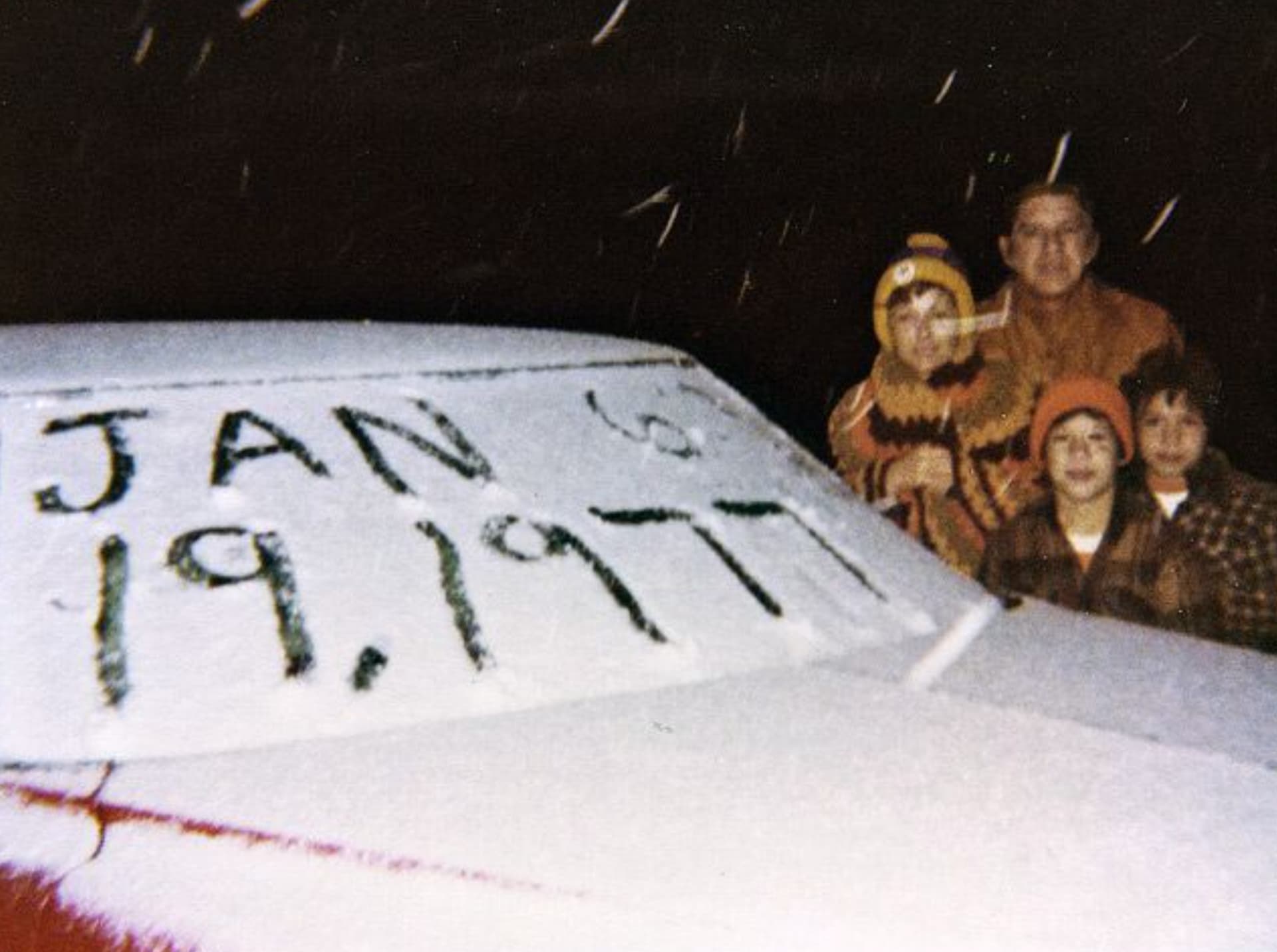 “Family posing with car on the day of the only known day of snowfall in Miami, Florida. 19 January 1977.”